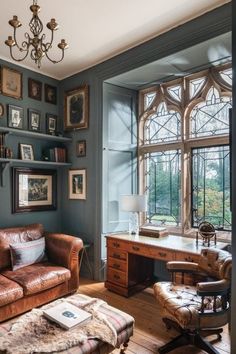 a living room filled with furniture next to a window covered in lots of framed pictures