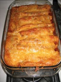 a casserole dish is sitting on the stove top, ready to be eaten