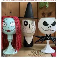 three eggs decorated to look like characters from the animated movie jack and sally - o - lantern