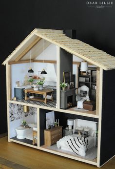 a doll house with furniture and accessories in it