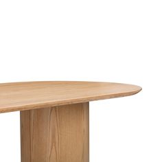 an oval wooden table against a white background