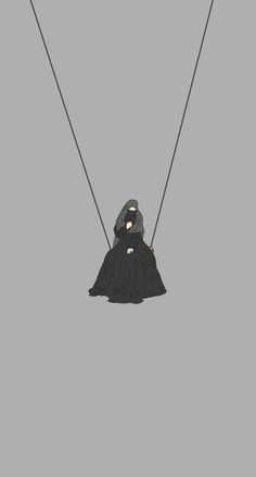 a person in a nun costume swinging on a rope with two strings attached to them