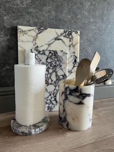 marbled bathroom accessories on wooden table in room