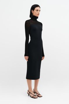 Beautiful simplicity. Our Marina is an elegant but subtly arresting turtleneck black midi dress with a turtleneck, European sheer jersey neckline, and extra long sleeves. This long sleeve turtleneck midi dress is fashioned from our softer, structured, mid-stretch European ponte for a body-hugging fit. We recommend wearing Marina with a strapless bra.[SPLIT] Emily is 5'9.5" (177 cm) tall, wearing size XS. Sam is 5'8" (173 cm) tall, wearing size XS. Total length approximately 50" (127cm). European Stretch Turtleneck Midi Dress For Party, Fitted Turtleneck Midi Dress For Party, Spring Bodycon Turtleneck Midi Dress, Fitted Elegant Long Sleeve Turtleneck, Elegant Fitted Long Sleeve Turtleneck, Sleek Fitted Midi Dress For Winter, Chic Turtleneck Midi Dress For Party, Elegant Stretch Turtleneck, Sleek Fitted Winter Midi Dress