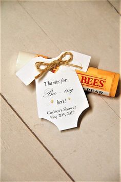 an orange and white candy bar tied with twine