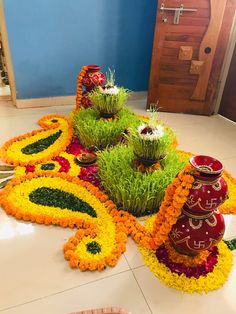 an arrangement of flowers and decorations on the floor