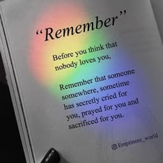 an open book with a rainbow light shining on the page and writing underneath it that says,'remember '