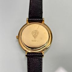 Classic ladies' Gucci watch, with minimalist black dial. Logo engraved on the crown. Quartz mechanism. New battery fitted and working perfectly.  Length: 8" Good condition overall, very light wear, no scratches on the crystal. Ships immediately Engraved Jewelry And Watches With Round Dial For Formal, Luxury Formal Watches Stamped 14k, Luxury Formal Watches 14k Stamped, Luxury 14k Stamped Formal Watches, Classic Round Engraved Jewelry And Watches, Elegant Black Engraved Watch, Black Engraved Watch For Formal Occasions, Gucci Watch Women, Gucci Watch