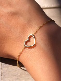 "14k / 18k Solid Gold \"Heart\" Bracelet Heart Thickness: 1.50mm Heart Size: 12mm x 10mm You can select The length of the chain when you make your order. Also, if you like us to make it adjustable for using it in 2 different lengths please let us know. For instance: in 6 inches and 6.5 inches. we will make it for you to wear it in both lengths. ( Just let us know) ** DELICATE HEART BRACELET FOR EVERYDAY WEAR OR FOR SPECIAL OCCASIONS. PERFECT BRIDAL PARTY GIFT AND VALENTINE'S DAY** **Box is Inclu Minimalist Open Heart Bracelet For Valentine's Day, Mother's Day Open Heart Bracelet, Dainty Open Heart Bracelets For Valentine's Day, Valentine's Day Open Heart Bracelet For Anniversary, 14k Gold Heart-shaped Bracelet For Valentine's Day, Yellow Gold Heart Cut Bracelet For Valentine's Day, Heart-shaped Gold Bracelet For Wedding, Heart-shaped Gold Bracelet For Valentine's Day Anniversary, Dainty Open Heart Bracelet For Valentine's Day