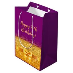 a purple and gold gift bag with a bow on the front that says 30 and fabulous