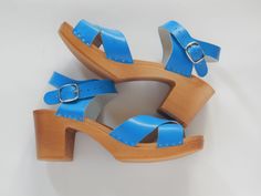 "READY TO SHIP size US9 ONLY. This listing is for clogs in size US 9 in colours: blue, yellow, purple. Height of heel 2.8\", natural leather and poplar wood. The clogs are availble also in black, white, sand/light beige, red, turquiose, yellow and purple. Please see other sizes: https://www.etsy.com/listing/637369372/leather-clogs-yellow-women-clogs-women?ref=shop_home_active_5 https://www.etsy.com/listing/637368204/handmade-clogs-women-clogs-purple?ref=shop_home_active_6 https://www.etsy.com/li Beach Clogs With Heel Strap, High Heel Clogs With Heel Strap For Beach, Beach Clogs With Heel Strap And Open Heel, Blue Closed Toe Clogs With Buckle Closure, Beach Clogs With Wooden Heel And Closed Toe, Blue Clogs With Wooden Heel For Summer, Blue Open Toe Mules With Wooden Heel, Shoemaker Workshop, Clogs Women