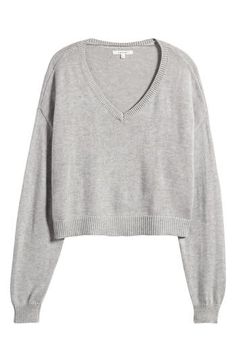 Give your off-duty fits a cozy boost in this cropped, boxy sweater made with a touch of wool for enhanced warmth. 19" length (size Medium) V-neck Long sleeves Dropped shoulders Ribbed cuffs and hem 50% nylon, 25% polyester, 15% acrylic, 10% wool Machine wash, dry flat Imported Cozy Cropped Relaxed Fit Sweater, Cozy Relaxed Fit Cropped Sweater, Casual Soft Knit Crop Top For Fall, Cozy Cropped Sweater With Relaxed Fit, Casual Soft Knit Cropped Top, Casual Cropped Sweater With Ribbed Cuffs, Gray Knit Cropped Sweater Casual Style, Casual Gray Knit Cropped Sweater, Casual Cozy Fit Cropped Sweater