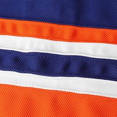 an orange and blue jersey with white stripes