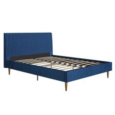 a blue bed with wooden legs and headboard