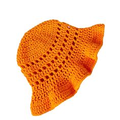 an orange knitted hat with holes on it