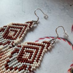 Handmade Brown Teardrop Beaded Earrings, Traditional Brown Beaded Earrings With Tiny Beads, Brown Dangle Beaded Earrings With Tiny Beads, Brown Dangling Bead Earrings, Brown Teardrop Beaded Earrings, Brown Teardrop Beaded Earrings With Colorful Beads, Colorful Brown Beaded Dangle Earrings, Colorful Beaded Brown Dangle Earrings, Traditional Brown Handwoven Beaded Earrings