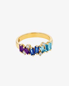 This half band ranks among our top-selling designs, beautifully crafted in 14-karat gold. It features an array of vibrant blue ombre semi-precious gemstones, perfectly complemented by the sparkle of round white diamonds. This ring combines color and elegance, making it a cherished piece in any collection. Details 14k yellow gold or rose gold 4x2mm baguette-cut iolite, English blue topaz, Swiss blue topaz and blue topaz gemstones 0.10 carats of round white diamonds 7mm width Ref: PR534BB Dress Reference, Italian Coast, Selling Design, Swiss Blue Topaz, Baguette Cut, Blue Ombre, Vibrant Blue, Topaz Gemstone, Precious Gemstones