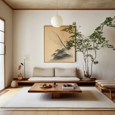 a living room with a couch, coffee table and potted plant