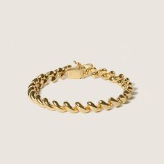 This bold twist bracelet is a classic and modern wardrobe workhorse. Its bold chain texture makes it stand out, yet the timeless design ensures its versatility. Metal: 14K Gold over Sterling Silver Chain size：200mm/7.87" Weight: 8g Formal Link Jewelry With A Modern Twist, Modern 14k Gold Curb Chain Bracelet, Gold Bracelets With Polished Finish And Modern Twist, Modern Twist Gold Bracelets With Polished Finish, Modern Yellow Gold Oyster Chain Bracelet, Elegant Cuban Link Chain Bracelet With Polished Finish, Modern 14k Gold Cuban Link Bracelets, Modern 14k Gold Chain Bracelet With Oyster Design, Twist Bracelet