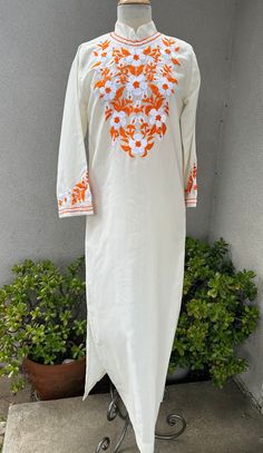 "Vintage boho white orange kaftan dress floral embroidered Sz small. Good condition with no label, polyester sheer fabric. Angel sleeves and back zipper plus side slits  Measurements  Shoulders 15\" Sleeves 21\" Bust waist 38\" Hips 42\" Length 55\"" White V-neck Kaftan For Spring, White Tunic Dress For Eid, White V-neck Embroidered Dress For Festival, Spring Long Kurta With Resham Embroidery, Traditional White Dress For Beach Cover-up, Spring Resham Embroidery Maxi Kurta, Long Embroidered Dress With Floral Embroidery For Vacation, White Kaftan For Eid Vacation, White Beach Dress For Eid