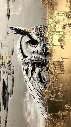 an owl painted on the side of a wall with gold paint and black spots around its eyes