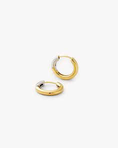 Do you have trouble picking between gold and silver jewelry? With our 3/4 Gold Hinge Hoop earrings, you don’t have to. These dainty pieces, measuring at .75” in diameter, incorporate recycled brass, sterling silver, and 14k gold plating. The gold hinge at the back of these silver hoop earrings creates an eclectic and easy look that can be worn everyday with any outfit or accessory. They look great with your hair up or down. Pair them with gold or silver jewelry; you can’t go wrong! Eclectic: Mixed and matched metals create an edgy, diverse vibe. Pair it with more earrings or add a charm; the hinge hoop earrings are versatile. Lightweight: Measuring at only .75” in diameter, this dainty accessory can adorn your ears all day without weighing them down or feeling heavy. Secure wear: The hinge Small Hoop Huggie Earrings In Yellow Recycled Gold, Yellow Gold Recycled Small Hoop Huggie Earrings, Small Hoop Huggie Earrings In Yellow Gold, Everyday Small Hinged Hoop Earrings, Gold Recycled Gold Huggie Earrings, Gold Round Huggie Earrings In Recycled Gold, Gold Huggie Hoop Earrings In Recycled Gold, Everyday Recycled Gold Hoop Earrings, Everyday Brass Jewelry With Gold Clasp