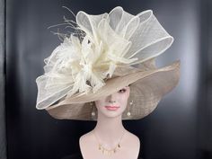 "Buying a hat? Don't forget to send me  your head measurement before placingyour order! IF YOU LIKE THE DESIGN, JUST WANT TO ADD SOME COLORS TO MATCH YOUR DRESS, PLEASE FEEL FREE TO CONTACT ME, I WILL DESIGN FOR YOU. This beautiful sinamay hat is an elegant wear at any church or derby event. its sinamay material is not too intimidating and attracts the eye. The chic flower adnorment that rests on the wide, side sweep brim is complemented by sinamay accentuations. Material: Sinamay with feather F Cream High Crown Fitted Hat, Beige Wide Brim Top Hat For Wedding, Beige Top Hat With Curved Brim For Wedding, Beige Curved Brim Top Hat For Wedding, Beige Short Brim Hat For Wedding, Beige Fitted Top Hat For Races, Beige Hat For Wedding At Royal Ascot, Elegant Cream Hats With High Crown, Elegant Cream Hat With High Crown