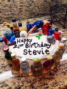 a birthday cake with bottles on it that says happy 21st birthday steieve in the middle