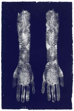 two hands with black and white designs on them