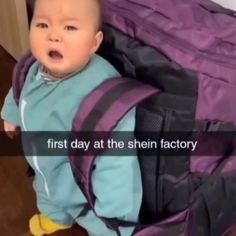 a baby is sitting in a purple backpack and has it's mouth wide open