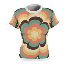 Step back in time with our groovy retro flower power shirt, a delightful homage to the vibrant fashion of the 60s and 70s. This women's fashion tee is inspired by the iconic and free-spirited era that brought us peace, love, and a whole lot of color! Crafted with an eye-catching design, this tee showcases a kaleidoscope of colorful flowers, reminiscent of the bold and psychedelic patterns that defined the flower power movement. The playful combination of vivid hues, from sunny yellows and earthy Retro Fitted Printed T-shirt, Retro Relaxed Fit T-shirt With Sublimation Print, Retro Printed Summer T-shirt, Summer Retro Print Crew Neck Top, Summer Crew Neck Top With Retro Print, Crew Neck Retro Print Summer Top, Retro Short Sleeve T-shirt With Floral Print, Retro Short Sleeve Printed T-shirt, Retro Printed Short Sleeve T-shirt