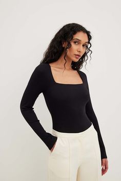 This top features a square neckline. It has long sleeves and tight fit. This top features a ribbed, stretchy material. Rib Knit Top, Twist Top, Sustainable Fashion Brands, Classic Coats, Ribbed Knit Top, Business Outfit, Women Long Sleeve Tops, Loungewear Sets, Beige Sweater