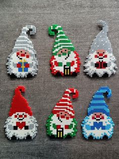 Elves made with Hama ironing beads. Ideal for your Christmas decoration! Nerdy Perler Beads, Christmas Knomes, Hama Beads Christmas, Ironing Beads, Christmas Perler Beads, Melty Bead Patterns, 3d Perler Bead, Fuse Bead Patterns, Homemade Christmas Decorations