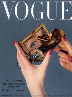 a magazine cover with an image of a woman's face holding a ring and purse