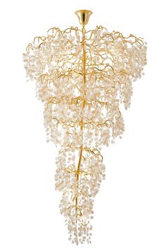 a gold chandelier with white beads hanging from it's centerpieces