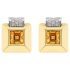 These gorgeous 50's style square earrings feature a 7.3mm vibrant square step cut citrine rubover set in the center. The gemstone is framed in a wide 18 carat yellow gold three-dimensional raised square mount, further designed with a white gold curve addition over the top inlaid with 9 round brilliant cut diamonds totalling to an approximate weight of 0.36ct. The earrings are perfectly finished with a secure French back closure, stamped 750. Square Stud Earrings, 50's Style, Step Cut, Square Earrings Studs, Square Stud, Square Earrings, Round Brilliant Cut Diamond, Three Dimensional, Citrine