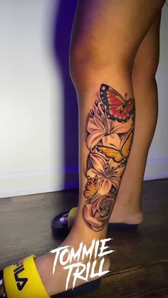 a woman's leg with butterflies and flowers on it, next to the words tommie trill