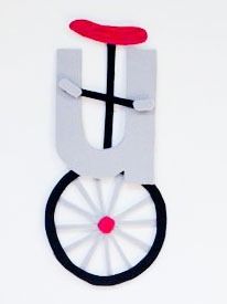 a paper cut out of a bicycle with wheels