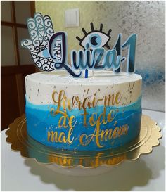 there is a cake that has been decorated with blue and white frosting