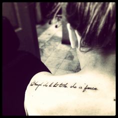 the back of a woman's upper arm with writing on it