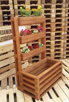 wooden pallet planters with flowers in them on top of wood pallets for sale