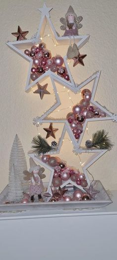 a christmas tree made out of stars and ornaments