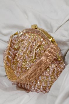 Pink clutch with sequin hand-embroidery and crystal-beaded hangings threaded throughout. Comes with embroidered top handle embellished with crystal tassels.
Type: Embroidered
Composition: Velvet, Faux Suede
Color: Pink
1 main compartment with small stitched pocket inside
Multi-bead tassels
Closure: Kiss lock clasp
Size (cm) approx: 22 x 5 x 18 - Aza Fashions Luxury Bags Collection, Vintage Evening Bags, Velvet Clutch, Embroidered Clutch, Suede Bag, Pink Clutch, Girly Bags, Pink Handbags, Purse Accessories