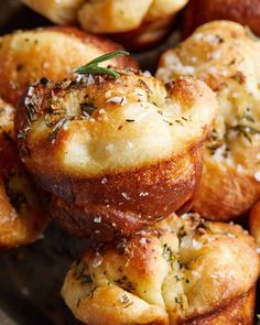 some bread rolls with herbs on top of them