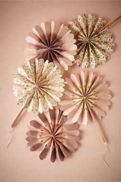 three paper flowers are shown on the page, and one is in color blush & lilac motif