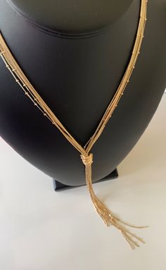 This 6 layered Chico's lariat necklace is bright and fun.  The choker part is 21 inches and the additional tassel is 11 inches .  This is a beautiful piece that is in fabulous condition.  It is signed with a tag at the clasp.  It is a great necklace to fritter with. I specialize in finding fun high quality fashion jewelry.  Please browse my shop for more options. Party Necklaces With Tassels And Dangle Shape, Party Tassel Dangle Necklaces, Party Dangle Necklaces With Tassels, Adjustable Double Strand Layered Necklace For Party, Party Necklaces With Tassels, Adjustable Gold Layered Necklace For Party, Long Tassel Necklace For Party, Adjustable Layered Necklace For Parties, Adjustable Delicate Chain Lariat Necklace For Party