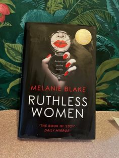 a book about ruthless women sitting on top of a table