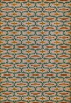 an old fashioned wallpaper pattern with circles and stars on the bottom, in green and gold