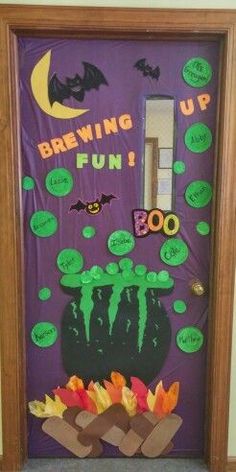 a door decorated to look like a bat and pumpkin with the words brewing fun on it