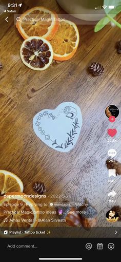 an image of oranges and pine cones on a wooden table with the word love